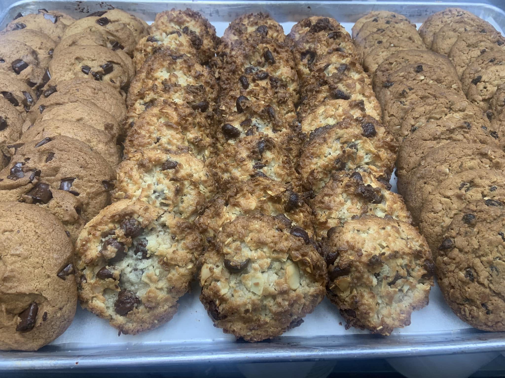 Trays of fresh-baked cookies - chocolate chip, coconut and oatmeal